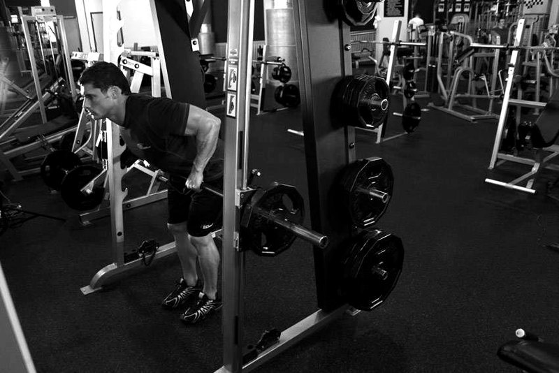 Smith Machine Bent Over Row — end position demonstration photo