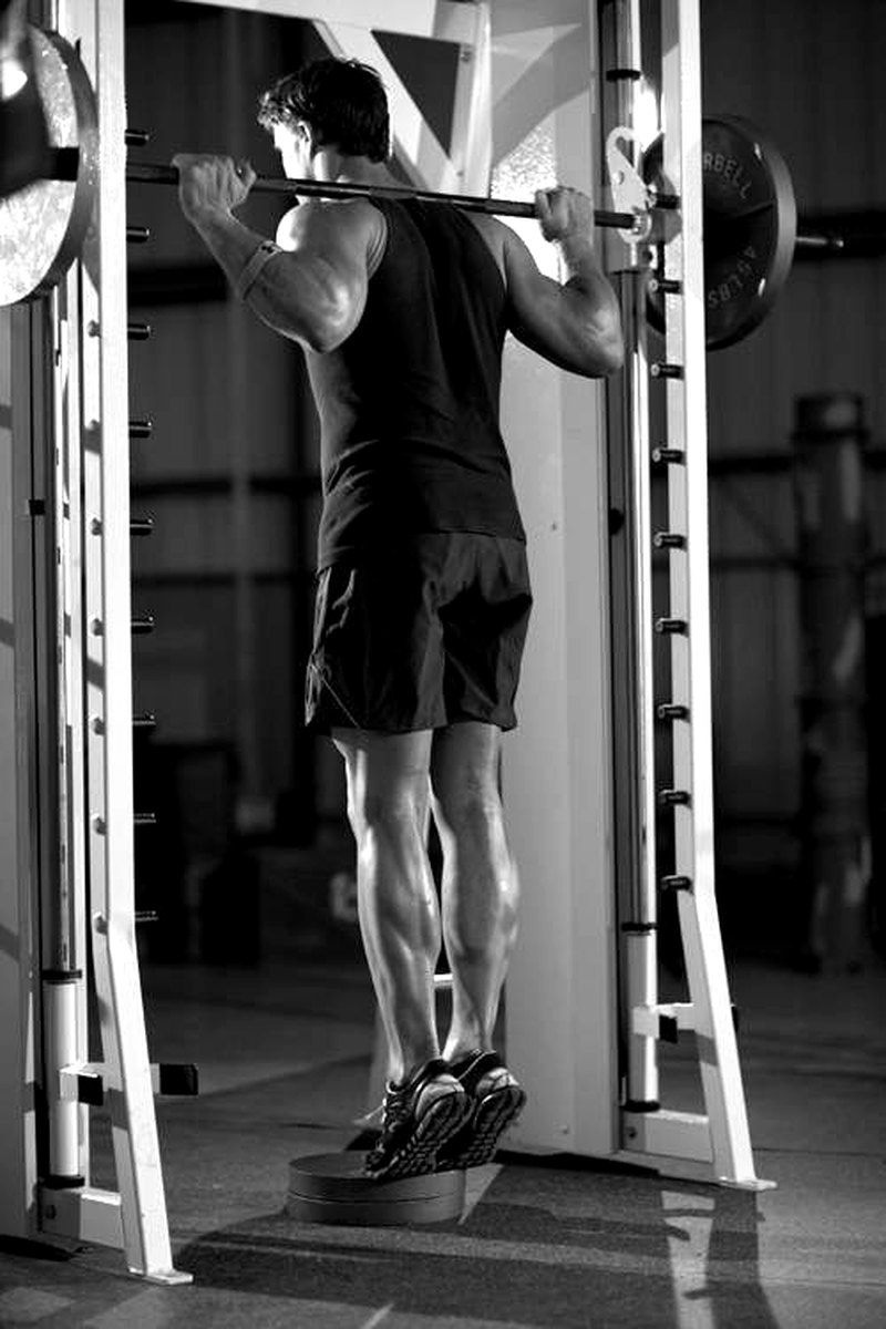 Smith Machine Calf Raise — end position demonstration photo