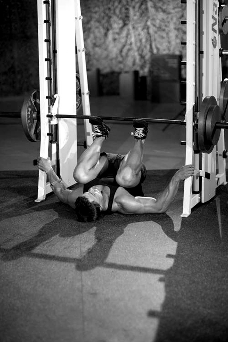 Smith Machine Leg Press — end position demonstration photo