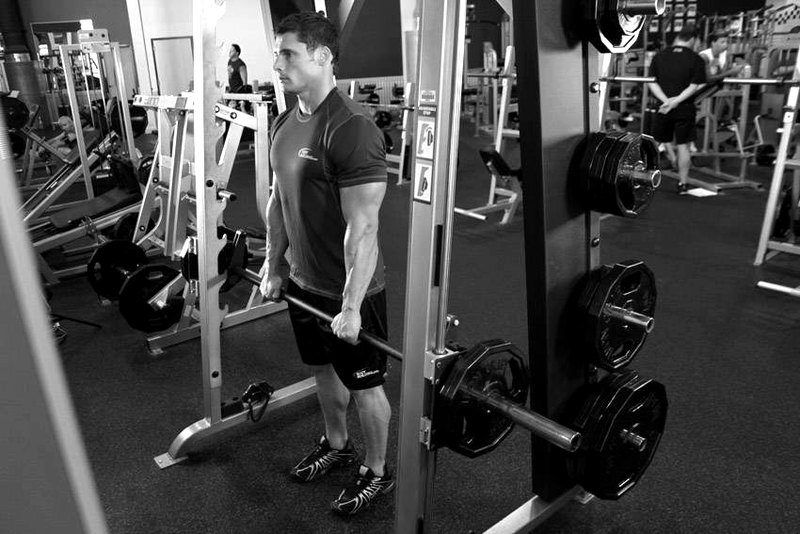 Smith Machine Stiff-Legged Deadlift — end position demonstration photo