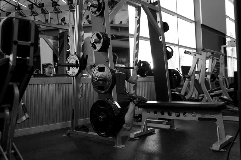 Smith Single-Leg Split Squat — end position demonstration photo