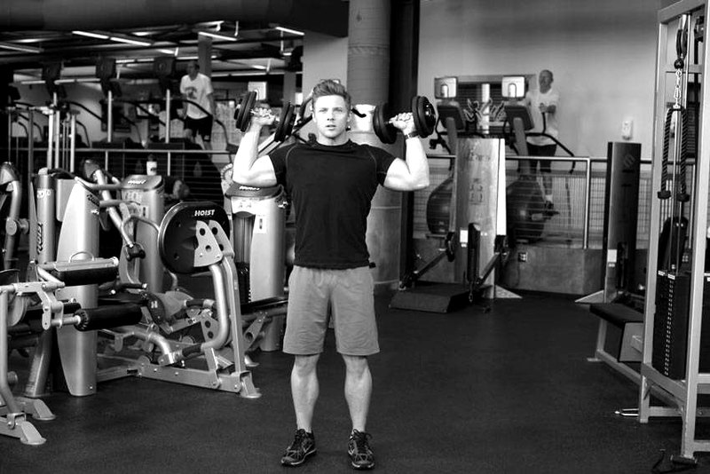 Standing Alternating Dumbbell Press — start position demonstration photo
