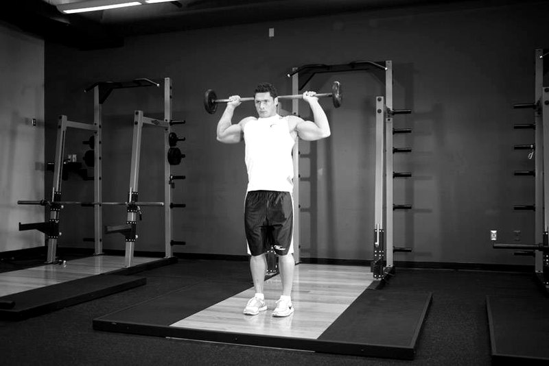 Standing Barbell Press Behind Neck — start position demonstration photo