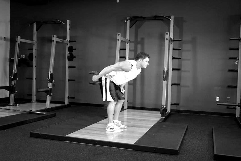 Standing Bent-Over One-Arm Dumbbell Triceps Extension — end position demonstration photo