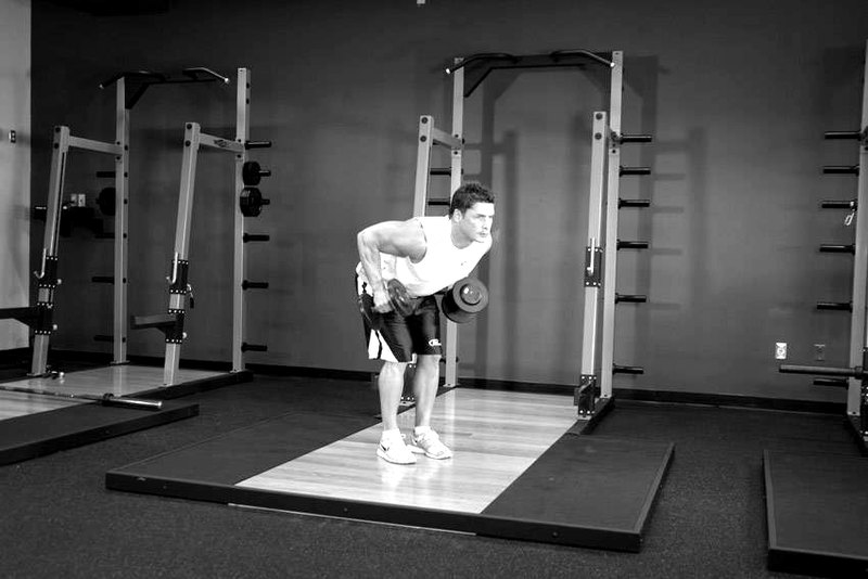 Standing Bent-Over Two-Arm Dumbbell Triceps Extension — start position demonstration photo