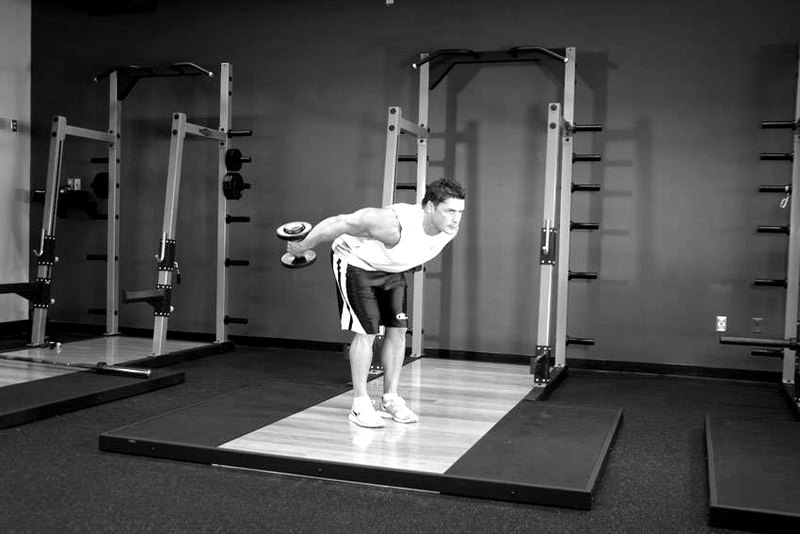 Standing Bent-Over Two-Arm Dumbbell Triceps Extension — end position demonstration photo