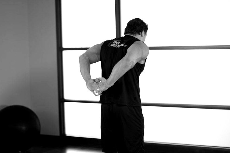 Standing Biceps Stretch — end position demonstration photo
