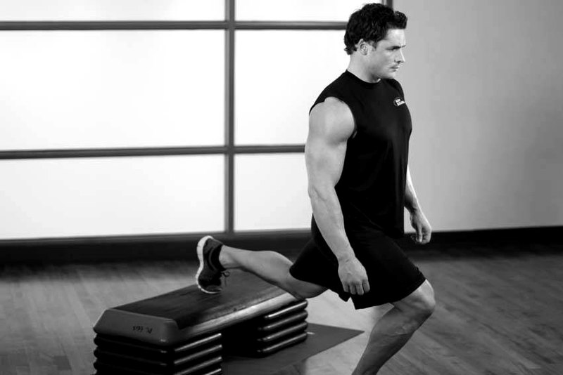 Standing Elevated Quad Stretch — start position demonstration photo