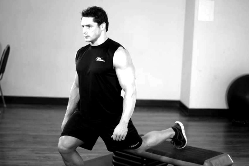 Standing Elevated Quad Stretch — end position demonstration photo