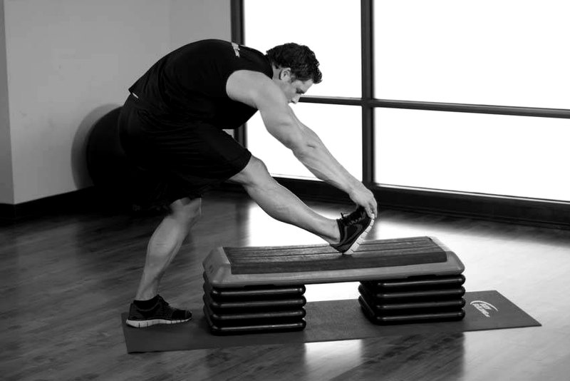 Standing Gastrocnemius Calf Stretch — end position demonstration photo