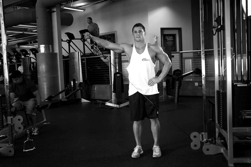 Standing Low-Pulley Deltoid Raise — start position demonstration photo