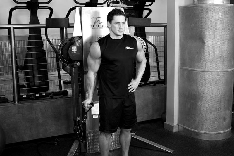 Standing One-Arm Cable Curl — start position demonstration photo