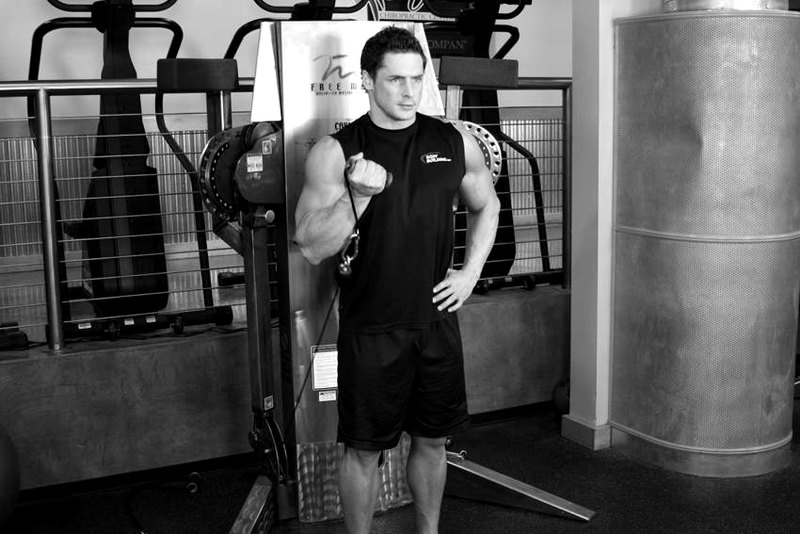 Standing One-Arm Cable Curl — end position demonstration photo