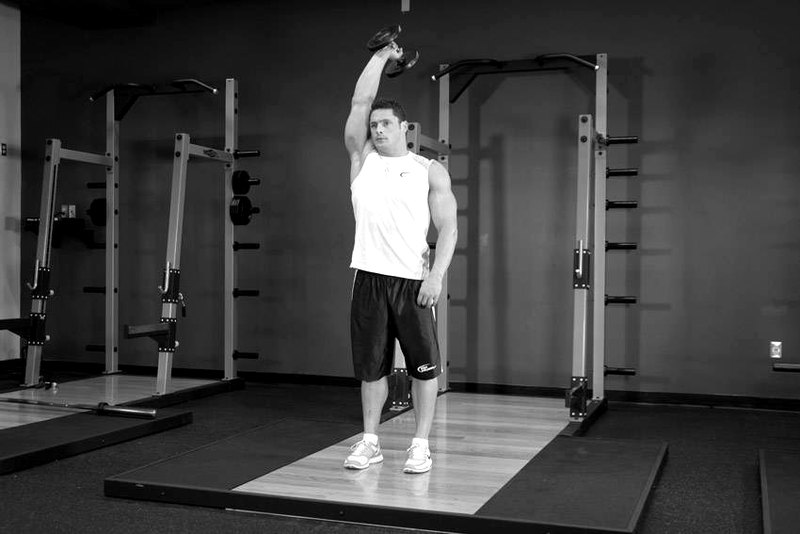 Standing One-Arm Dumbbell Triceps Extension — start position demonstration photo
