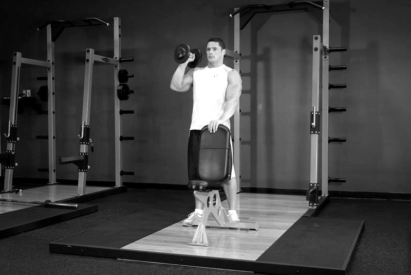 Standing Palm-In One-Arm Dumbbell Press — start position demonstration photo