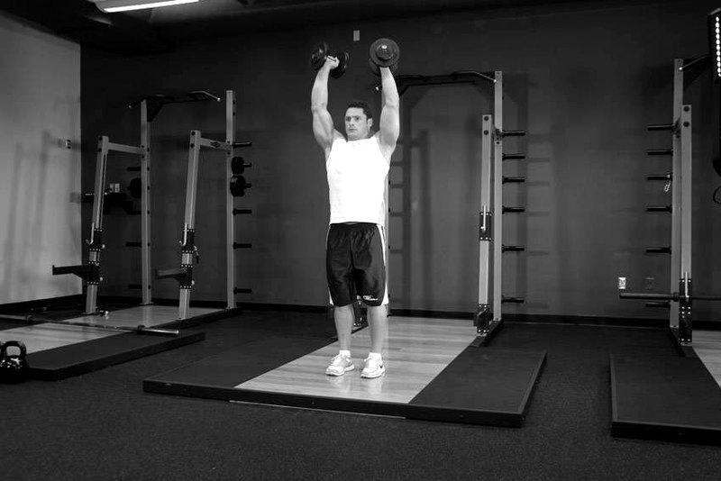 Standing Palms-In Dumbbell Press — start position demonstration photo