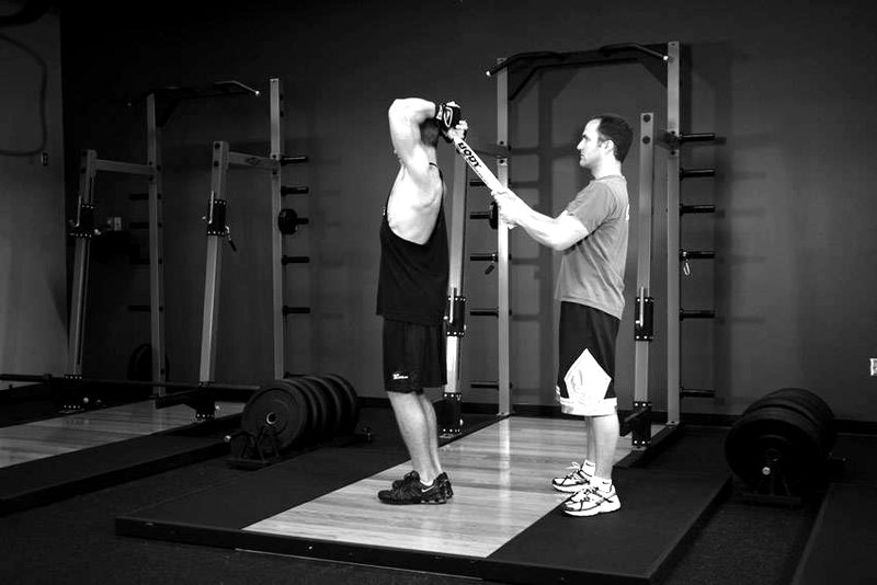 Standing Towel Triceps Extension — start position demonstration photo
