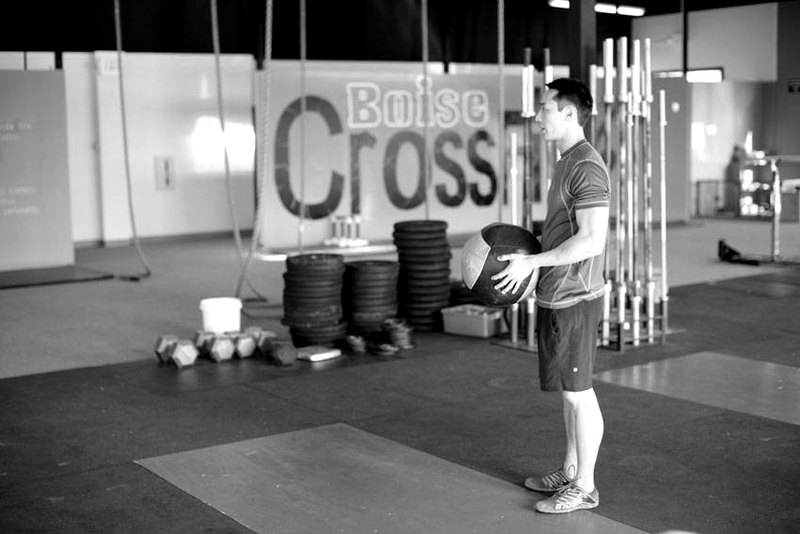 Standing Two-Arm Overhead Throw — start position demonstration photo
