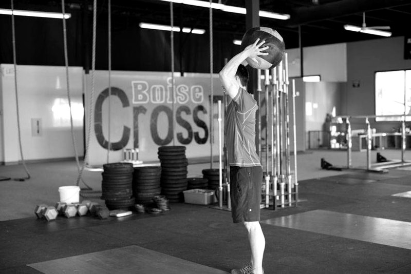 Standing Two-Arm Overhead Throw — end position demonstration photo