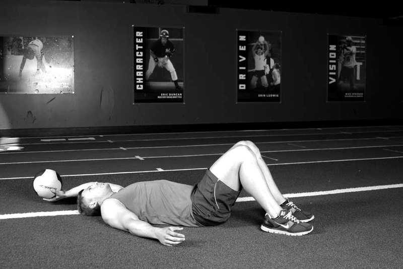 Supine One-Arm Overhead Throw — start position demonstration photo