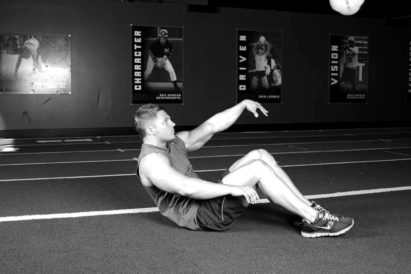 Supine One-Arm Overhead Throw — end position demonstration photo