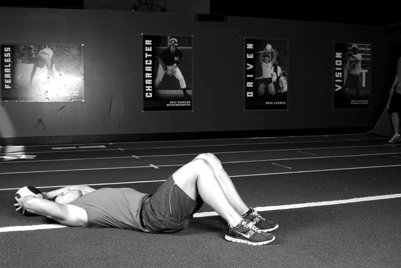 Supine Two-Arm Overhead Throw — start position demonstration photo