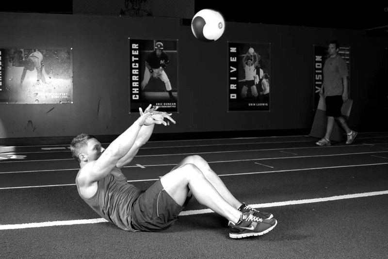 Supine Two-Arm Overhead Throw — end position demonstration photo