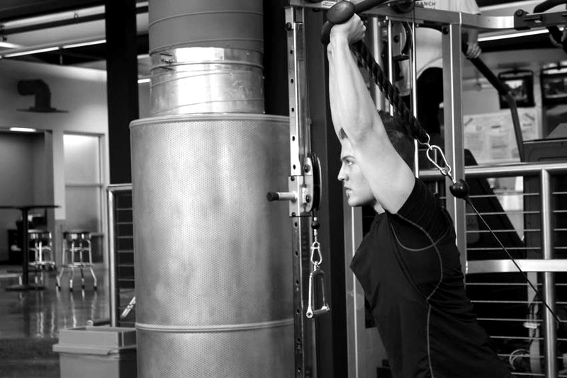 Triceps Overhead Extension with Rope — end position demonstration photo