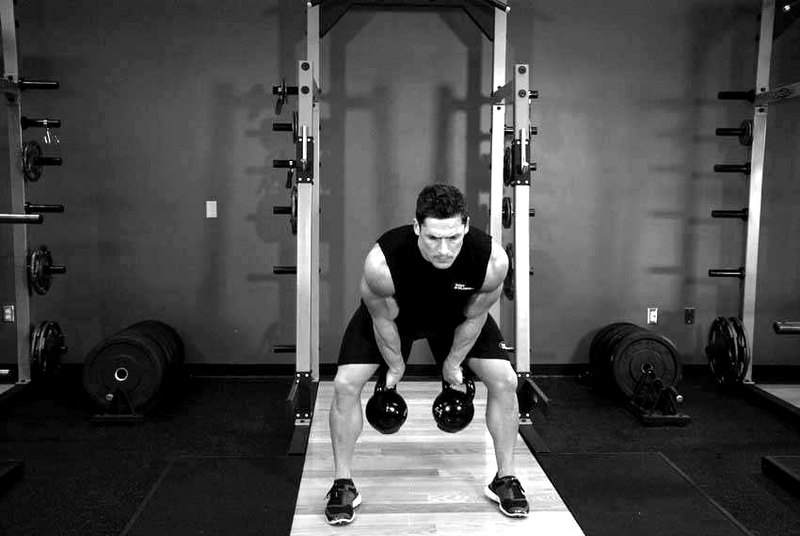 Two-Arm Kettlebell Clean — start position demonstration photo