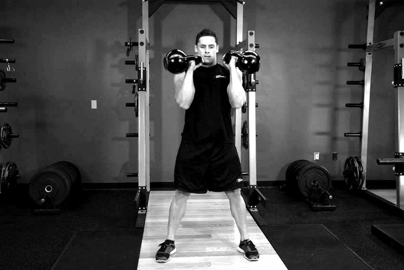 Two-Arm Kettlebell Clean — end position demonstration photo