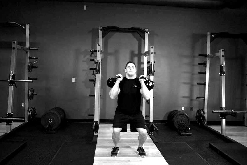 Two-Arm Kettlebell Jerk — start position demonstration photo