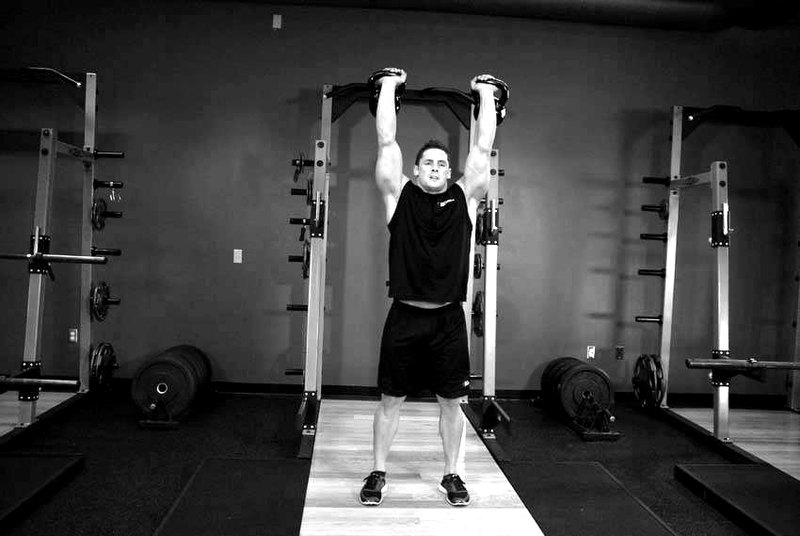 Two-Arm Kettlebell Jerk — end position demonstration photo