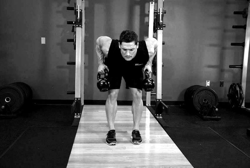 Two-Arm Kettlebell Row — end position demonstration photo