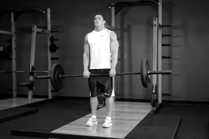 Upright Barbell Row — end position demonstration photo