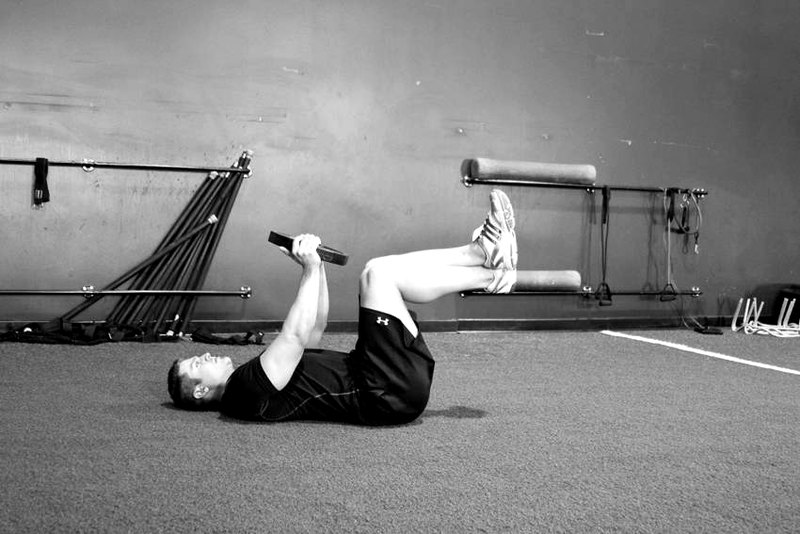 Weighted Crunches — start position demonstration photo