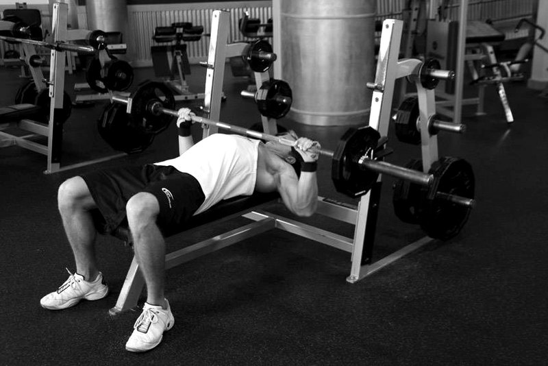 Wide-Grip Barbell Bench Press — end position demonstration photo