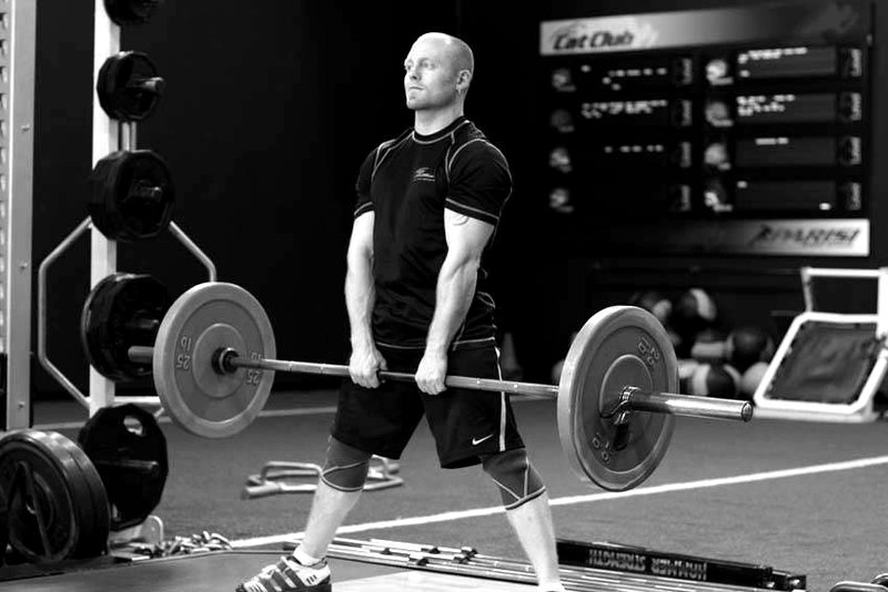 Wide Stance Stiff Legs — end position demonstration photo